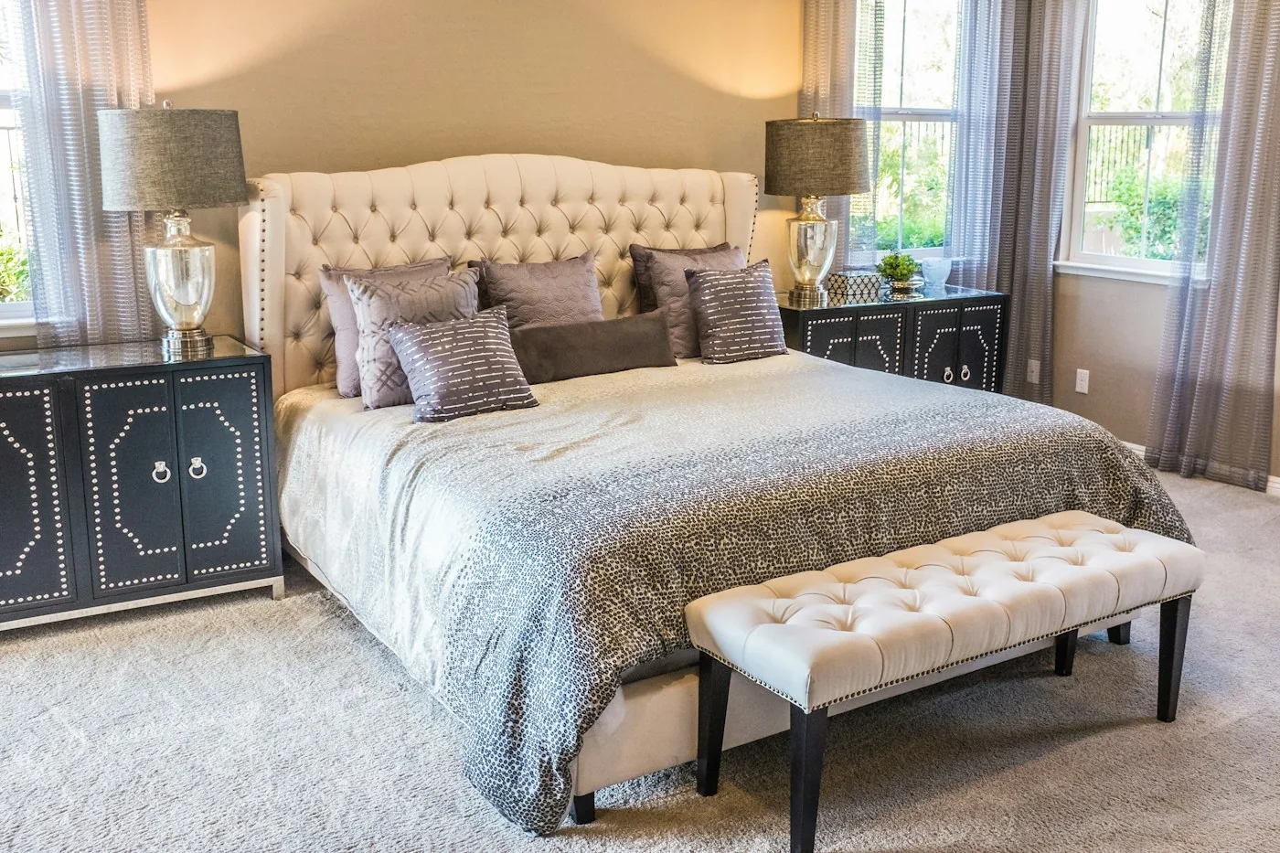 Bedroom with an upholstered headboard and bench; illustrative interior, not a Dore & Rose product photograph